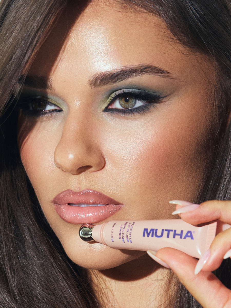 Brook Walmart of CGM Models holding MUTHA Pucker Up Plumping Lip Treatment, photographed by Josh Eskridge at Know Good Studio in Miami with makeup by Shani Gottlieb.